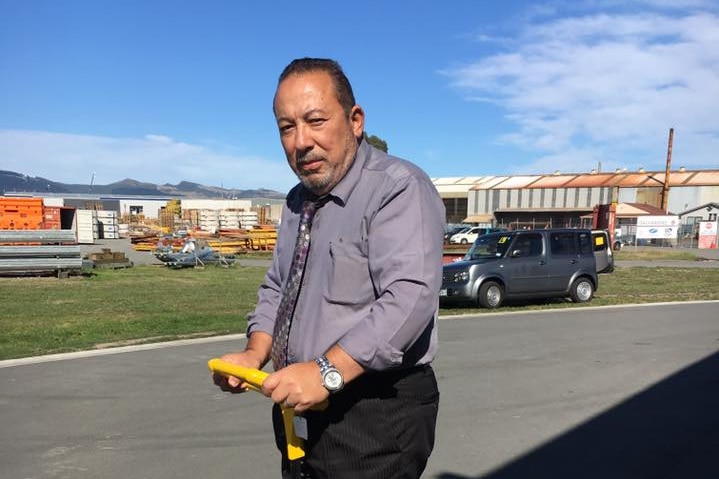 A photo of Mohsen Mohammed Al Harbi, who is riding a Segway. He is wearing a purple shirt with a tie.