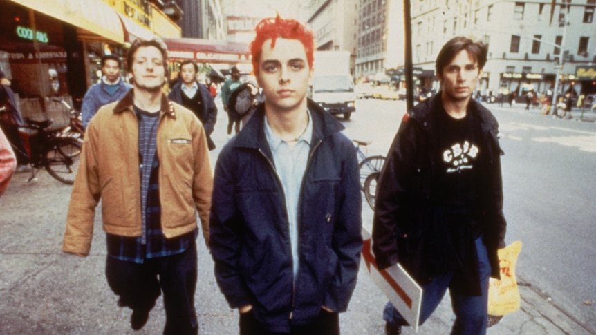 Green Day's Mike Dirnt, Billie Joe Armstrong and Tre Cool walk down a New York City street