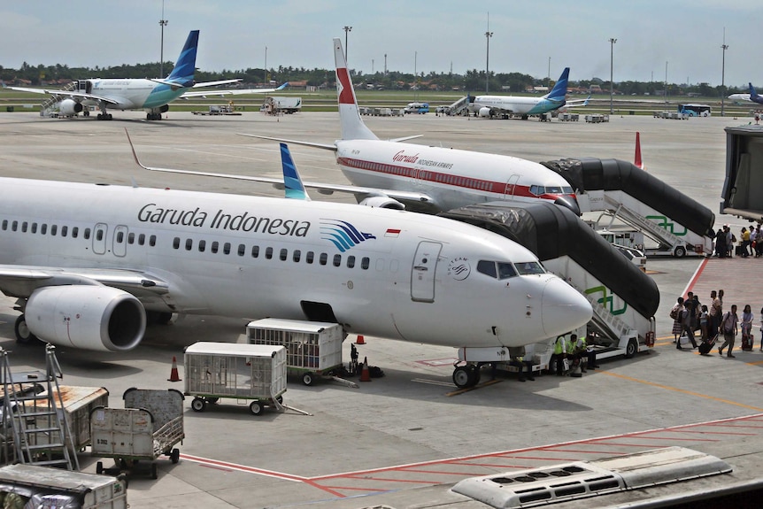 Garuda Indonesia planes parked at the main international airport serving Jakarta.