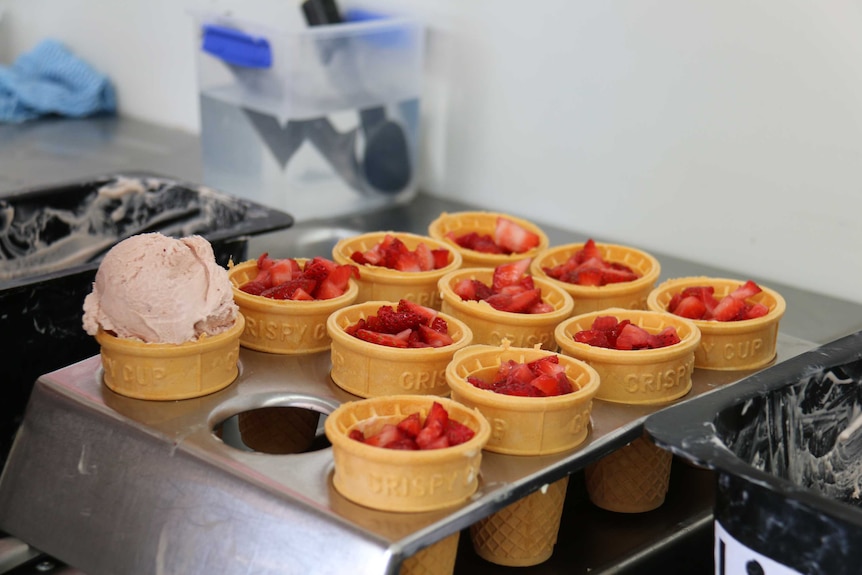 Chopped strawberries in cones