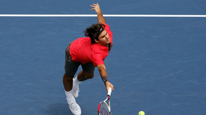 Roger Federer returns a shot