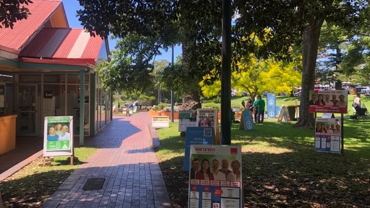 Election signs stand in front of a pre-poll voting station at Kiama