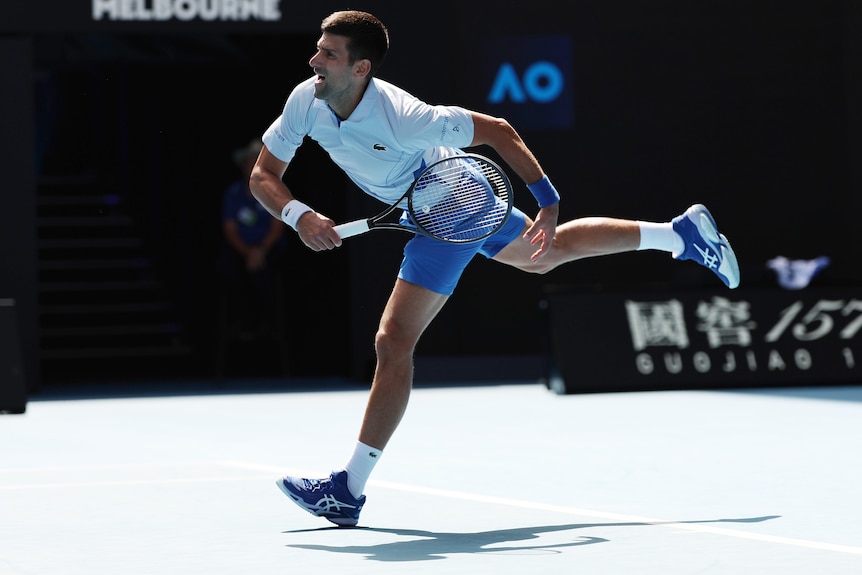 Novak Djokovic serves during Australian Open semifinal.
