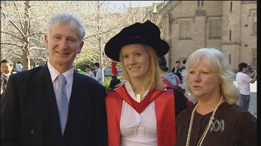 Dr Caitlin McOmish celebrates her graduation with her parents, Lachie and Janie.