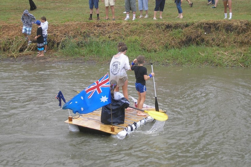 Locals take part in the Oakey Creek Cup raft race on Australia Day, 2013.