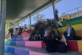 Groups of anonymous students together at lunch time at a state high school in Brisbane's western suburbs.
