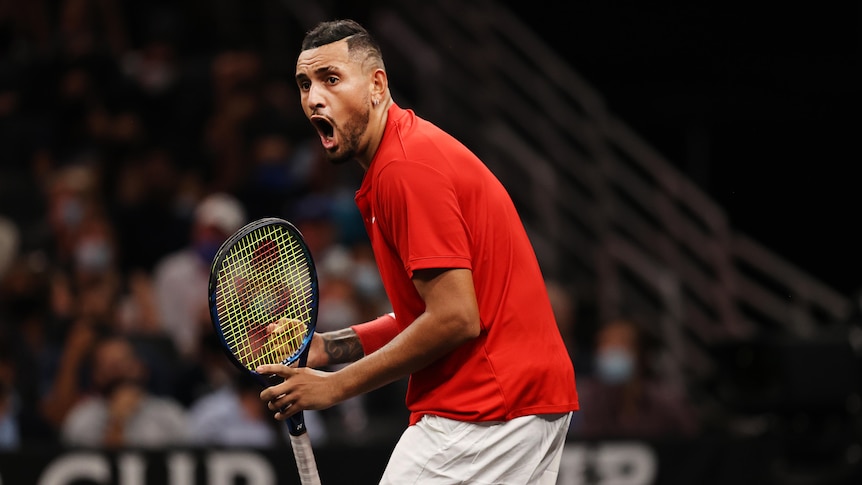 Nick Kyrgios bends over and opens his mouth wide