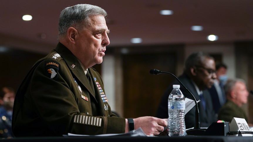 Mark Milley speaks into a microphone whiile wearing military uniform during a Senate Armed Services Committee hearing.