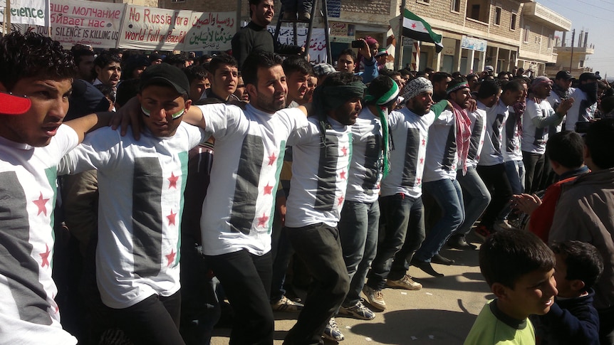 Bloody struggle ... demonstrators take part in a protest against Syria's president Bashar al-Assad.