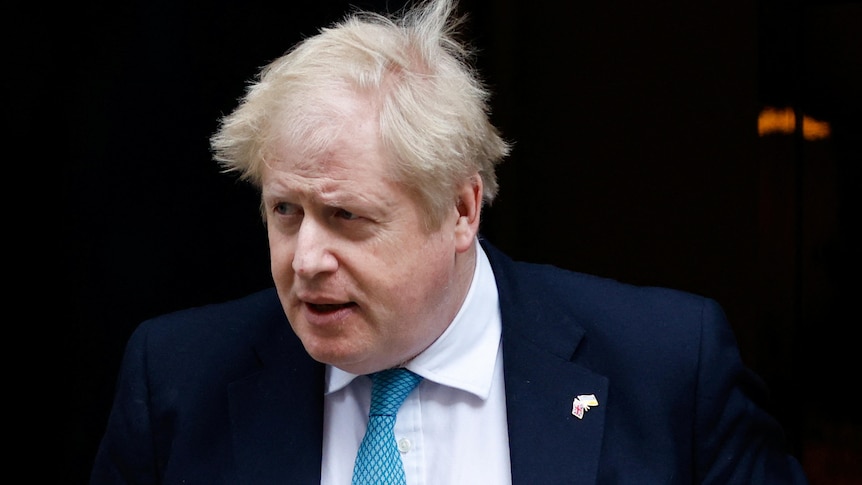 A close up of Boris Johnson exiting Downing Street with a neutral expression on his face.