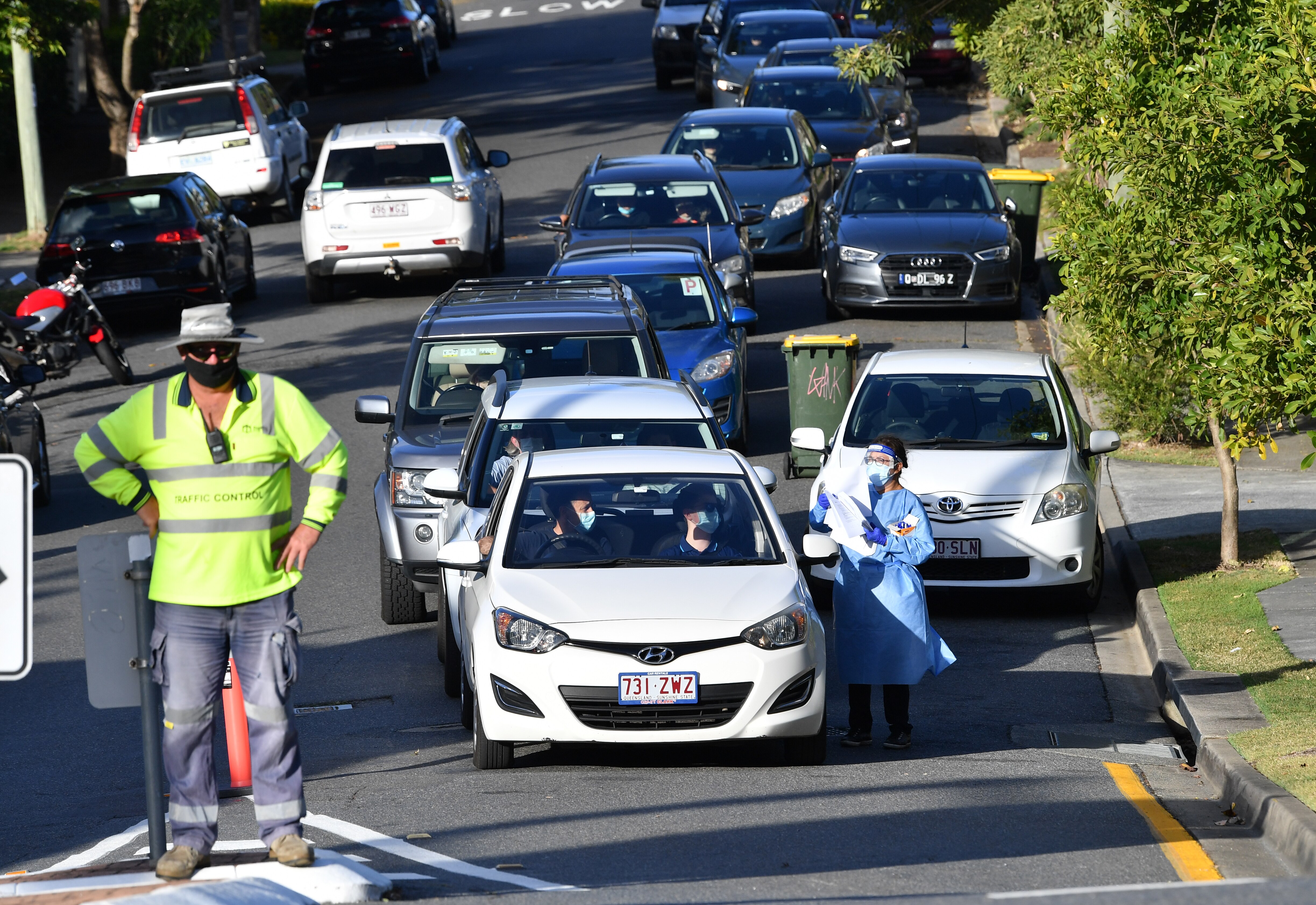 People waiting for COVID-19 testing lined up in their cars at Highgate Hill in Brisbane