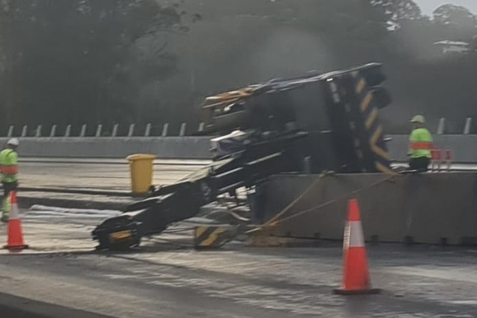 A crane on its side at roadworks