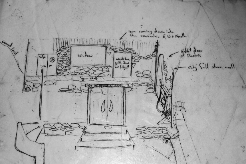 Floorplan for The Outpost drawn on a piece of stone.
