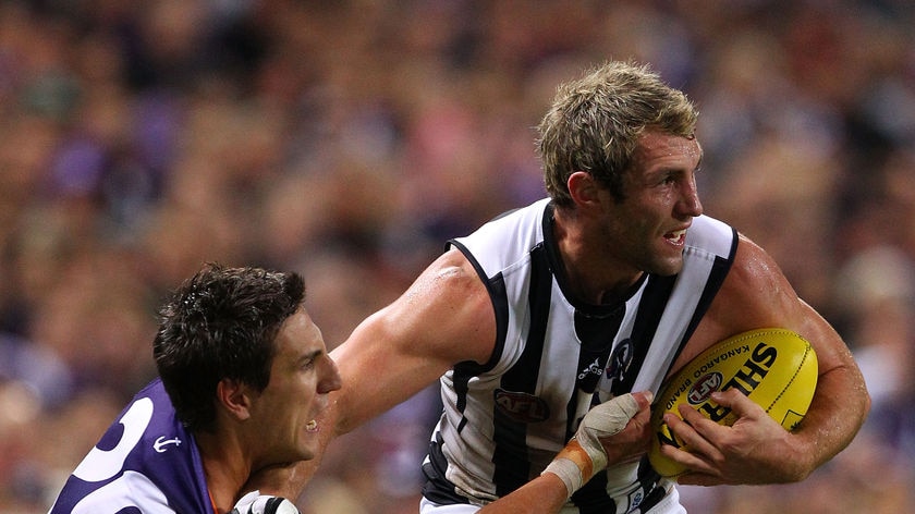 Travis Cloke (right) has come to terms with the Pies