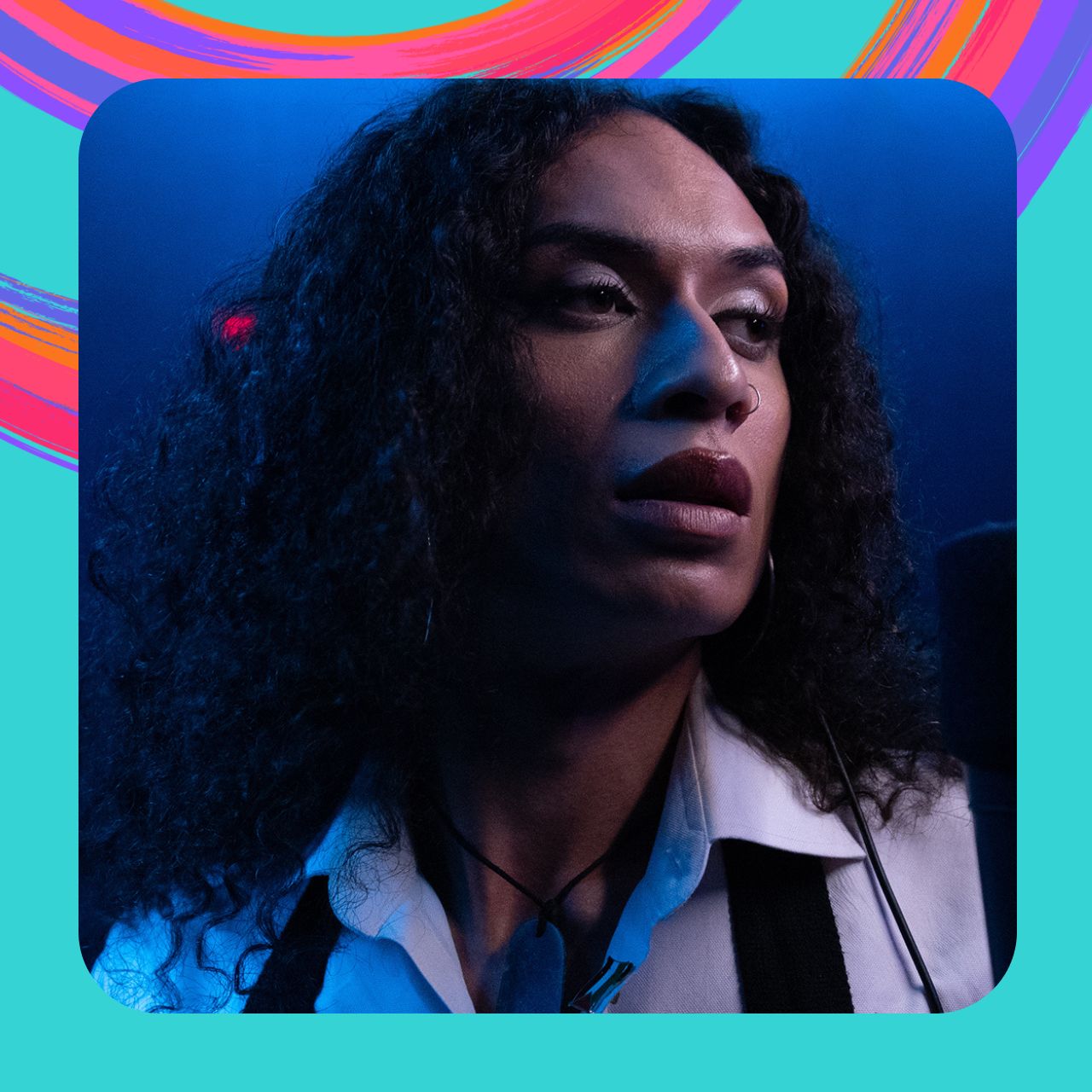 Jamaica Moana looks into the distance, wearing a white shirt and with her hair out.