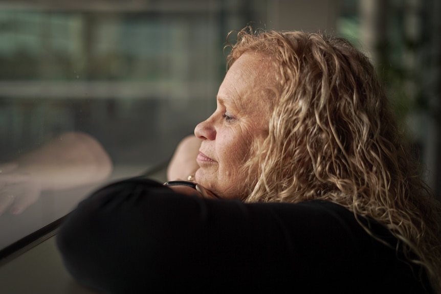 A woman looking out of the window.