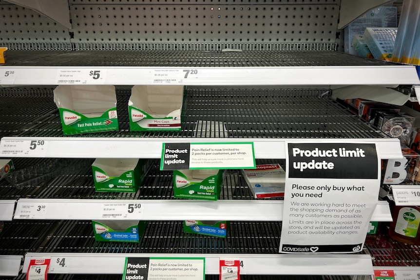 Empty shelves of paracetamol medication at a supermarket