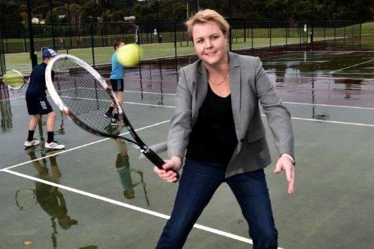 A woman playing tennis.