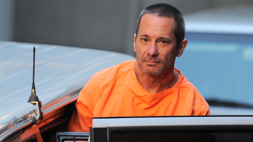 Walter Marsh is escorted to a prison van in Sydney