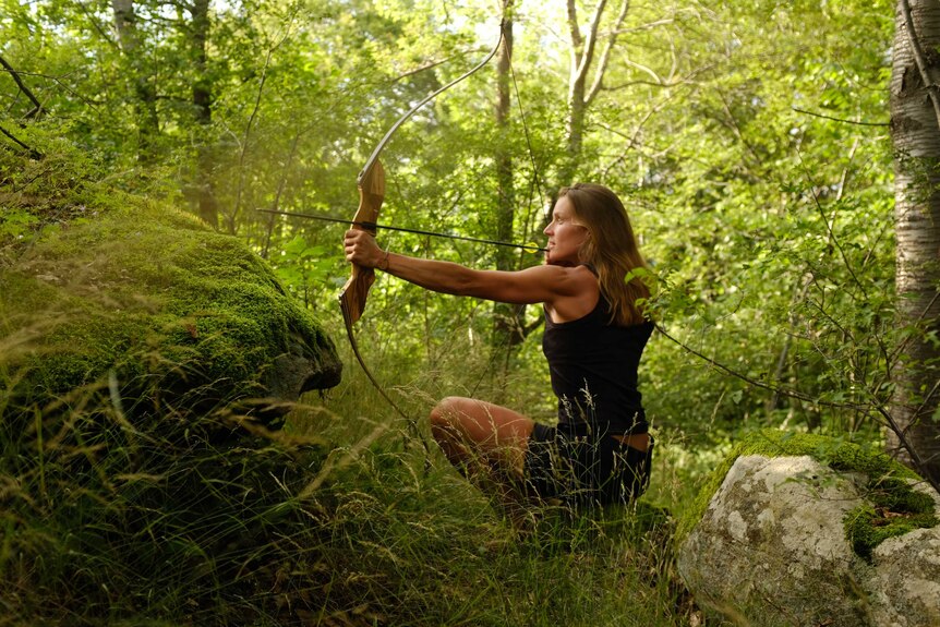 Miriam Lancewood with bow and arrow