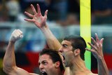 Garrett Weber-Gale and Michael Phelps celebrate gold after a dramatic men's 4x100m relay.
