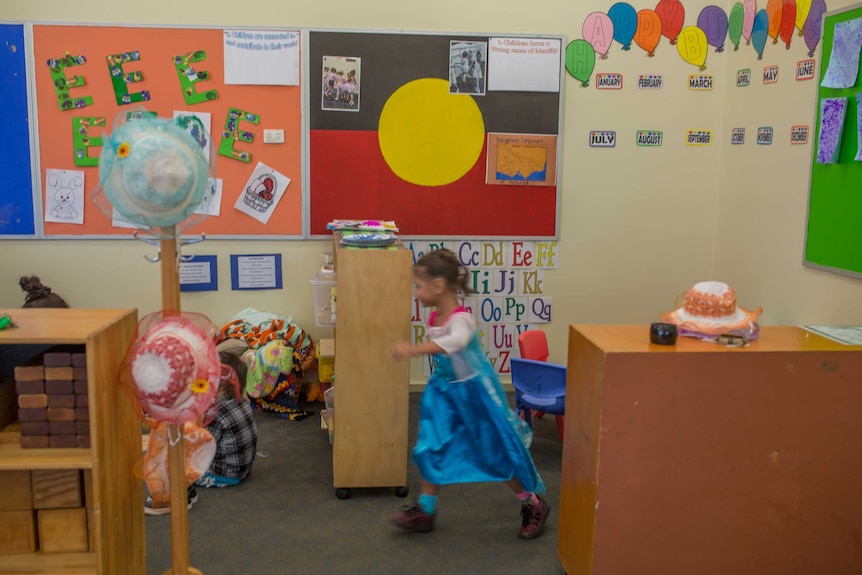 A child runs through the childcare centre 