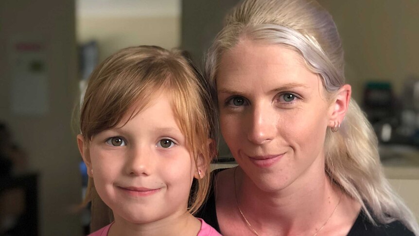 Emma Taylor holds her six year old daughter Felicity