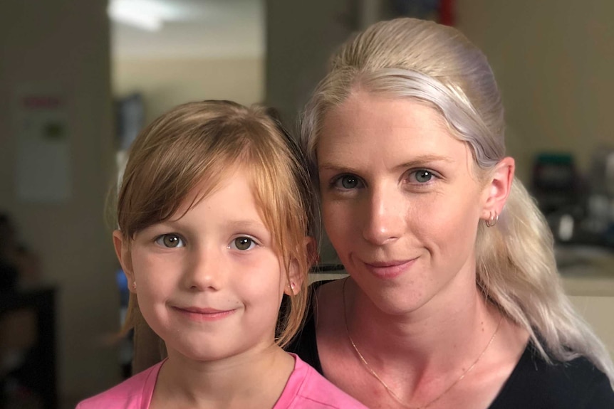 Emma Taylor holds her six year old daughter Felicity