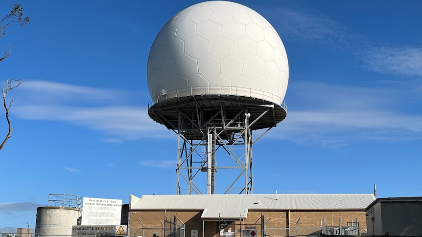 A large, spherical radar device that looks like a massive golf ball.