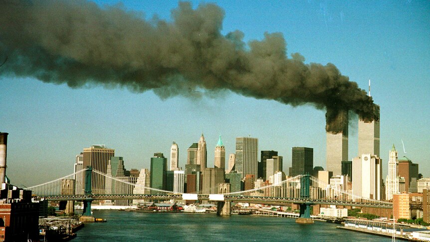 Smoke rises from the towers of the World Trade Center shortly after being struck