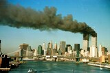 Smoke rises from the towers of the World Trade Center shortly after being struck