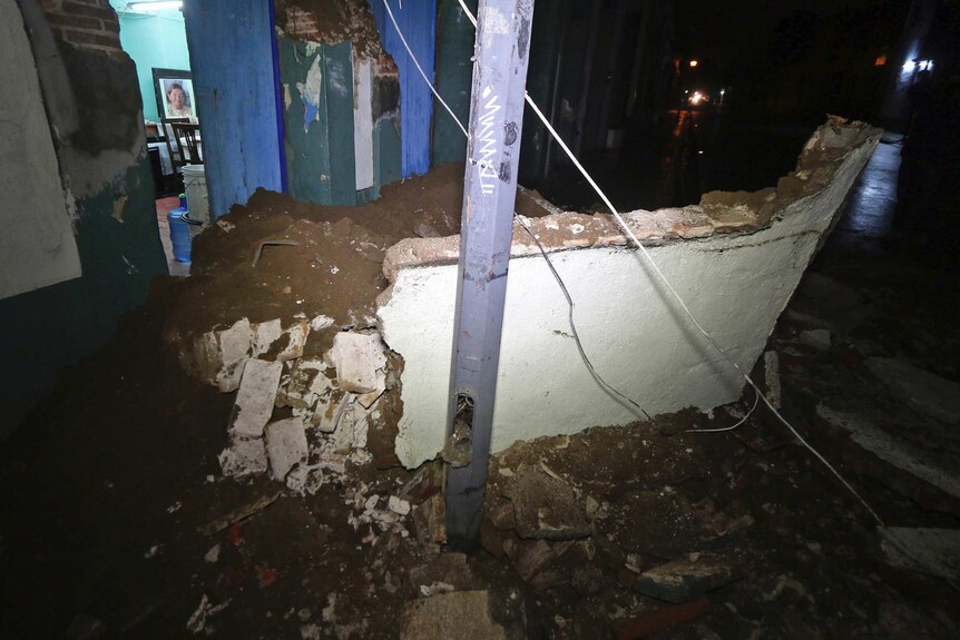 Damaged entrance to a home in Oaxaca - the entire side of the house is collapsed