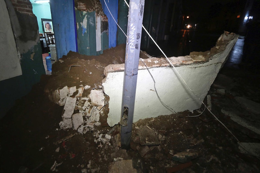 Damaged entrance to a home in Oaxaca - the entire side of the house is collapsed