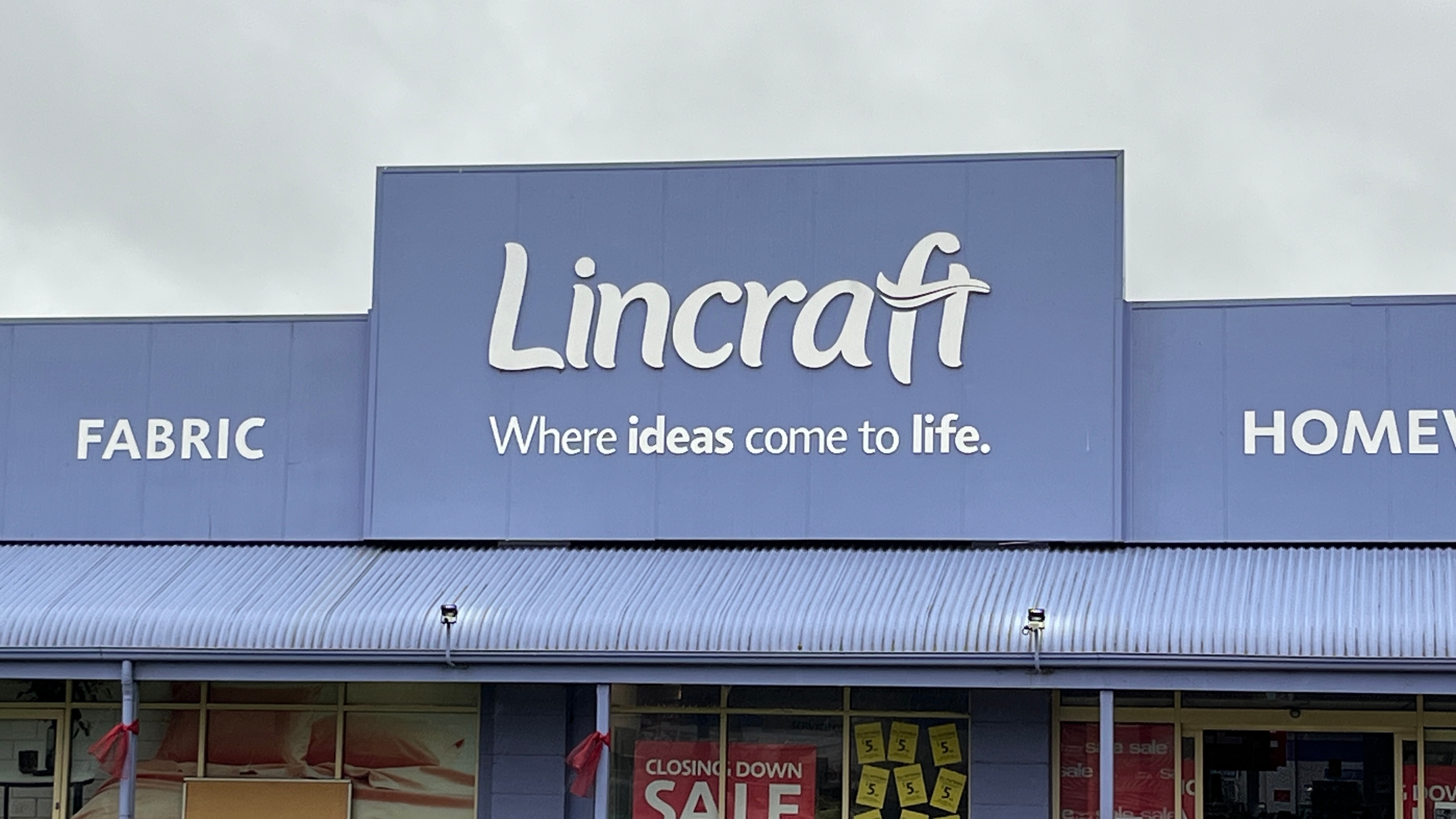 A+close-up+shot+of+a+store+front.+%27Lincraft%27+is+in+white+on+a+blue+background.+Tag+is+%27where+ideas+come+to+life%27.
