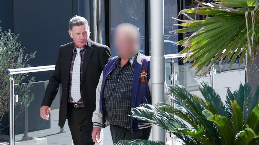Two men walk out of the court in Toowoomba