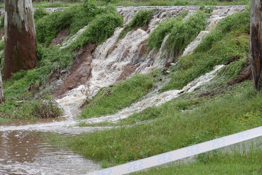A flood levee breaking