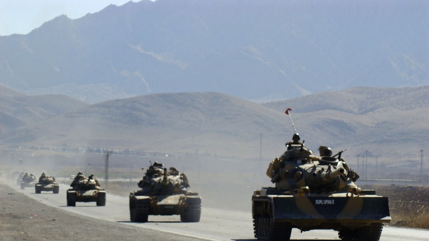 Turkish tanks move near the south-eastern Turkish town of Silopi, near the Iraqi border.