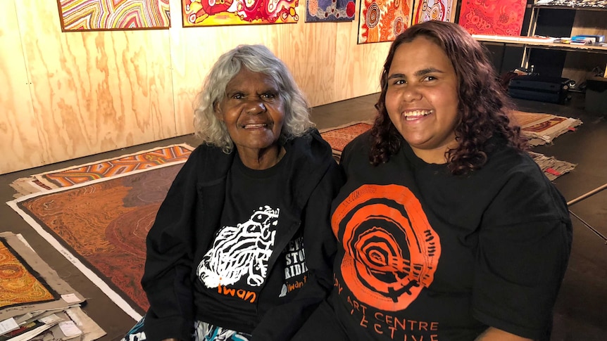 Amata artist Nyurpaya Kaika Burton and Sally Scales at the Tarnanthi Art Fair in Adelaide.