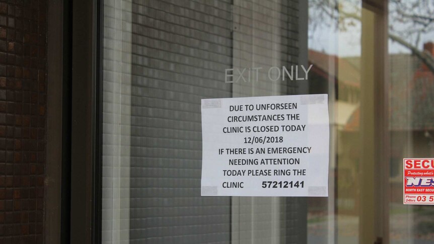 A sign on a window says the clinic is closed for the day due to unforseen circumstances.