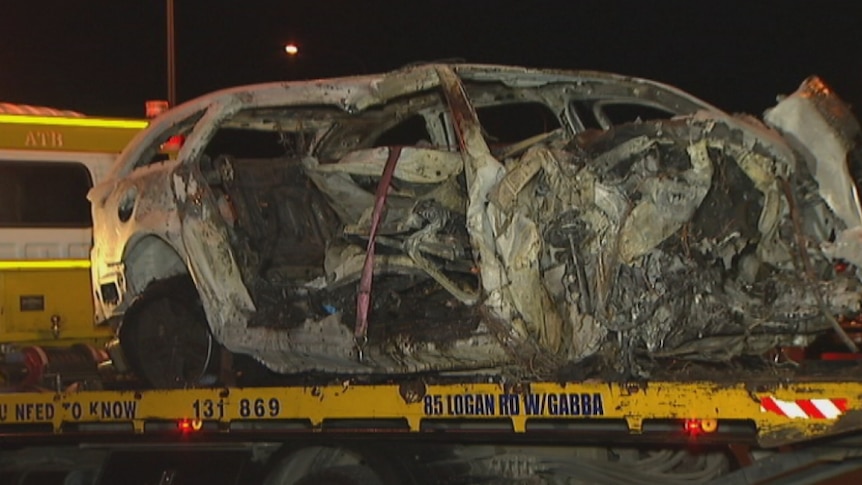 A person died after the car they were driving crashed into trees and caught on fire