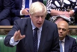 Boris Johnson gestures in parliament.