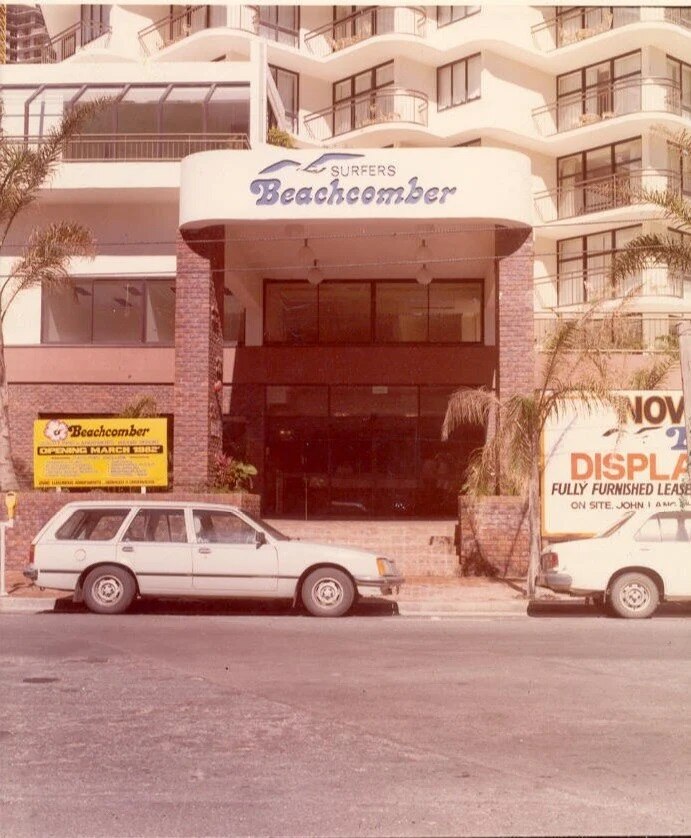 Exterior of the Beachcomber apartments with a car parked outside