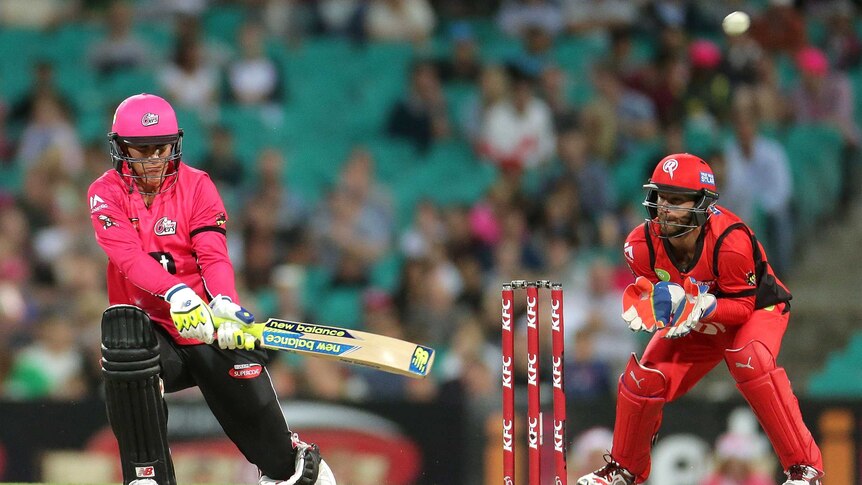 Nic Maddinson hits a six for the Sydney Sixers in the Big Bash League against Melbourne Renegades.