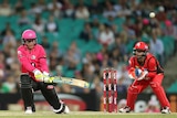 Nic Maddinson hits a six for the Sydney Sixers in the Big Bash League against Melbourne Renegades.