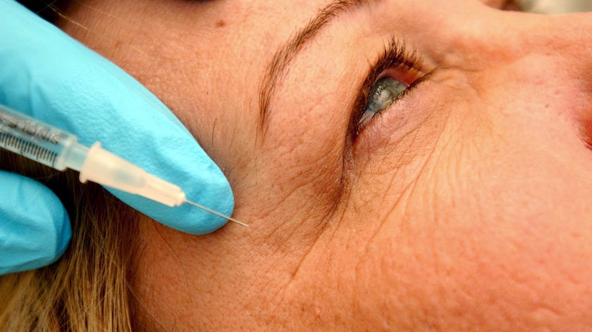 Close-up of woman getting an injection of Botox