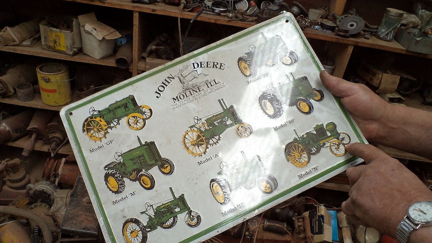 Close up shot of John Deere tractor chart in farm workshop