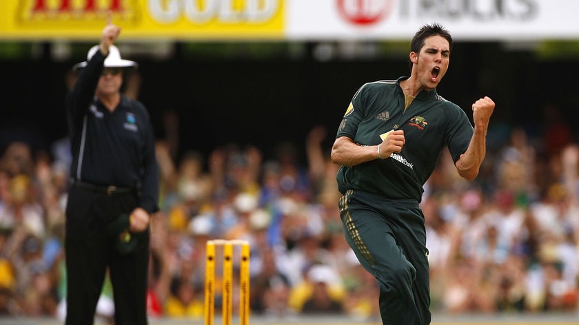 Breakthrough... Mitchell Johnson claims the vital wicket of Ghambir.