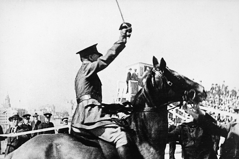a man on a horse holding a sword
