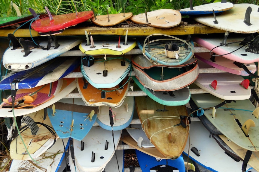 A stack of surfboards near 'The Spot' on West Island at the Cocos Keeling Islands.