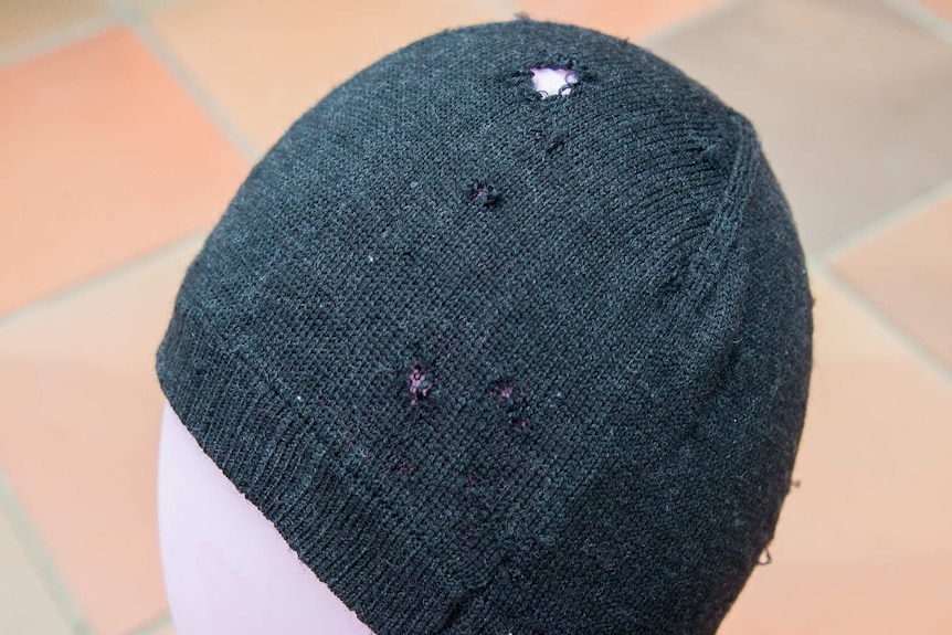 Woollen beanie with moth holes